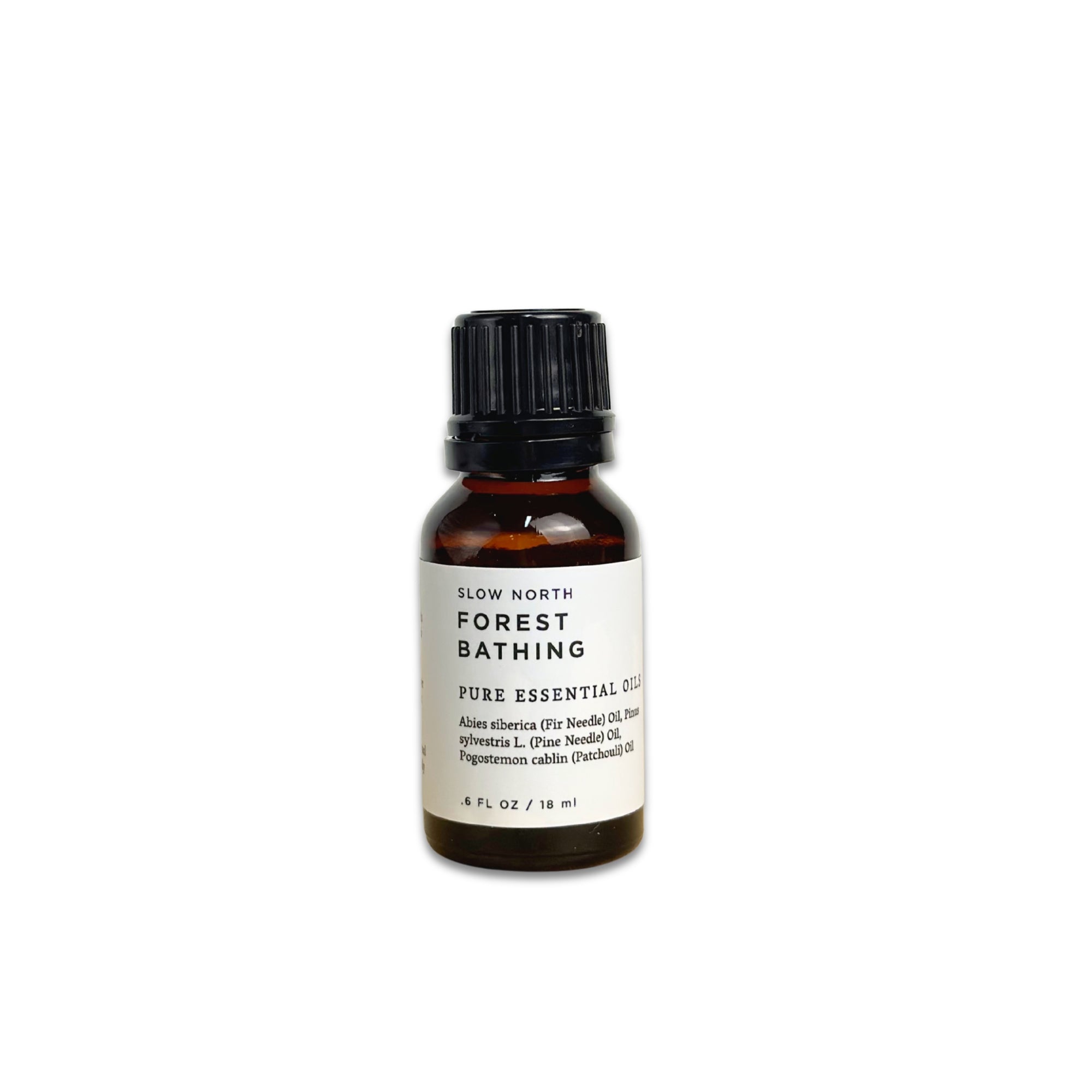 Bottle of 'Forest Bathing' pure essential oil on a white background