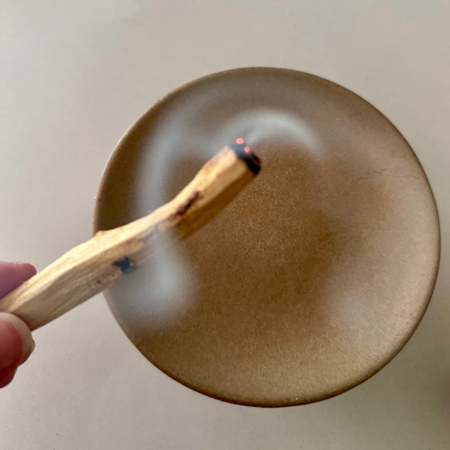 Smudging with a Palo Santo incense stick