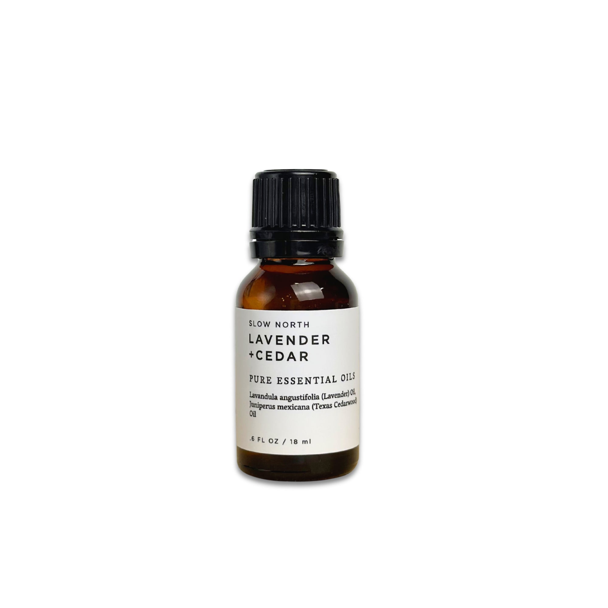 Brown essential oil bottle with a white label on a white background