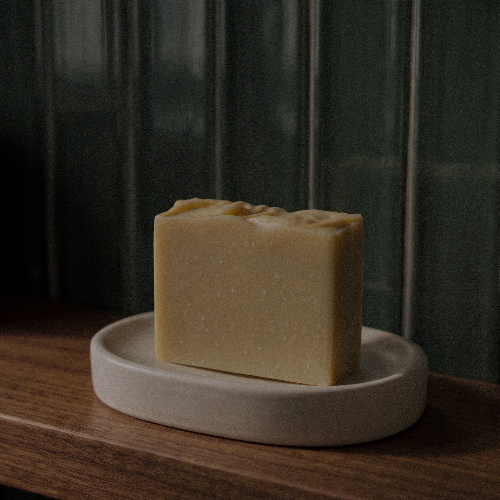 lemongrass + tangerine bar soap on soap dish