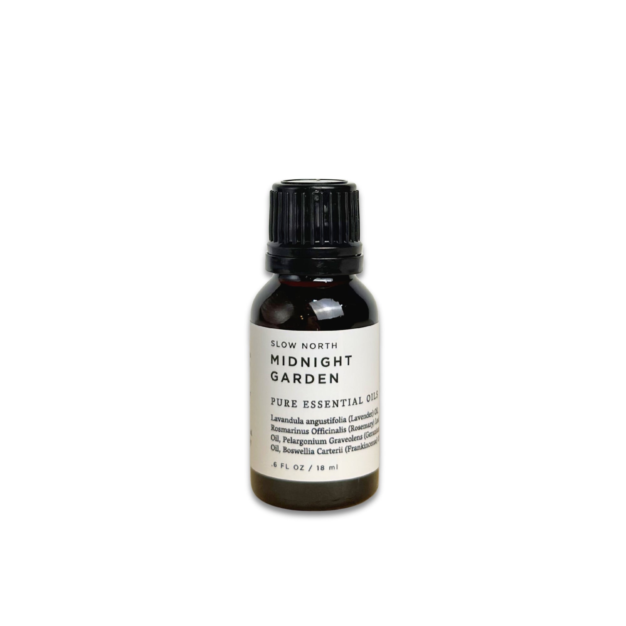 Bottle of Slow North Midnight Garden pure essential oil on a white background