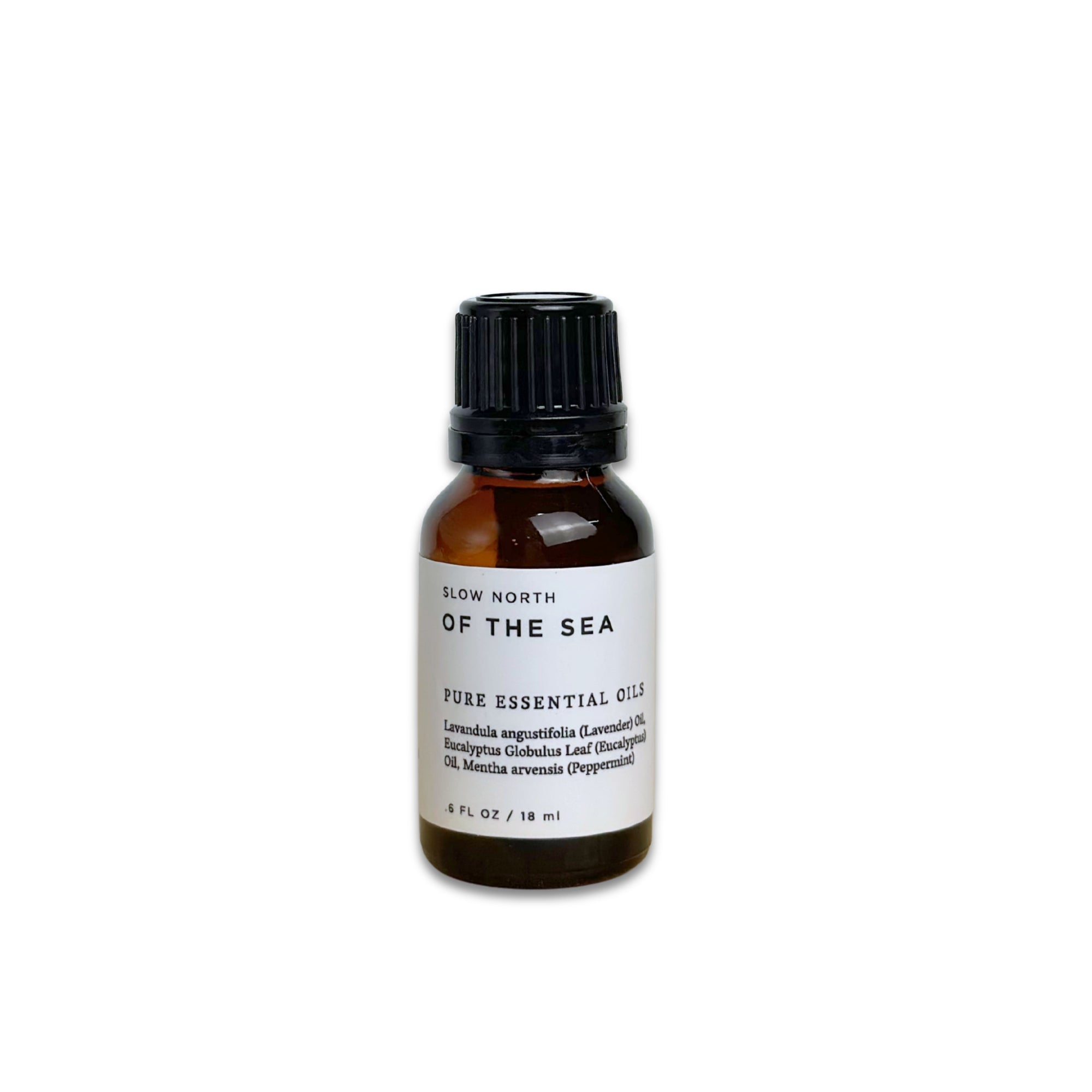 Bottle of 'Of the Sea' pure essential oil on a white background