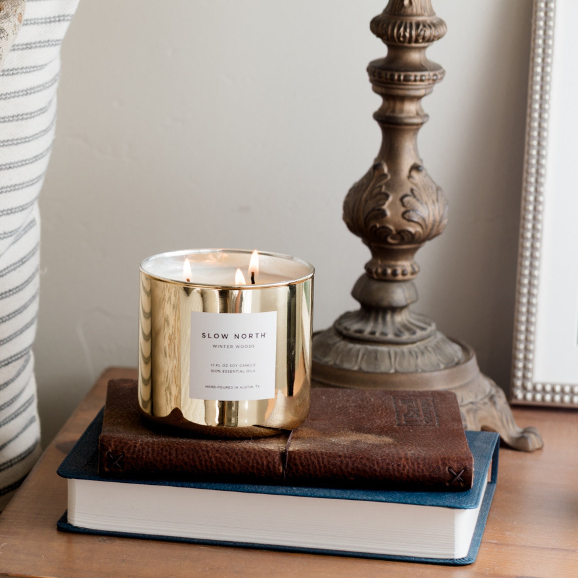 Winter Woods Gold Candle on nightstand