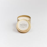 Grapefruit + Spearmint soy wax candle in 6 ounce gold travel tin by Slow North