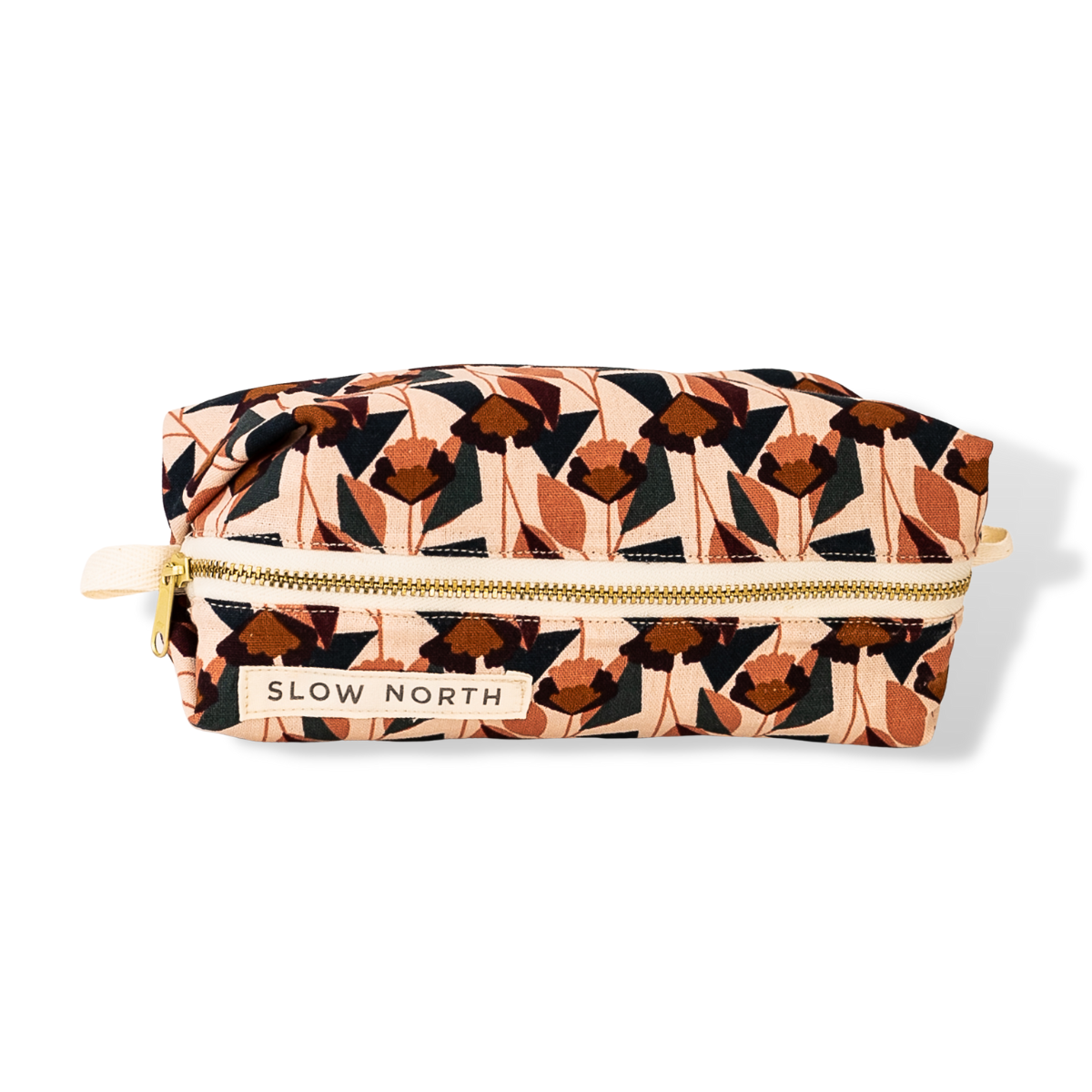 Colorful geometric pattern of various pinks, cream, dark blue, dark orange.