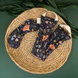 Neck wrap + eye mask in canyon springs floral pattern on round placemat