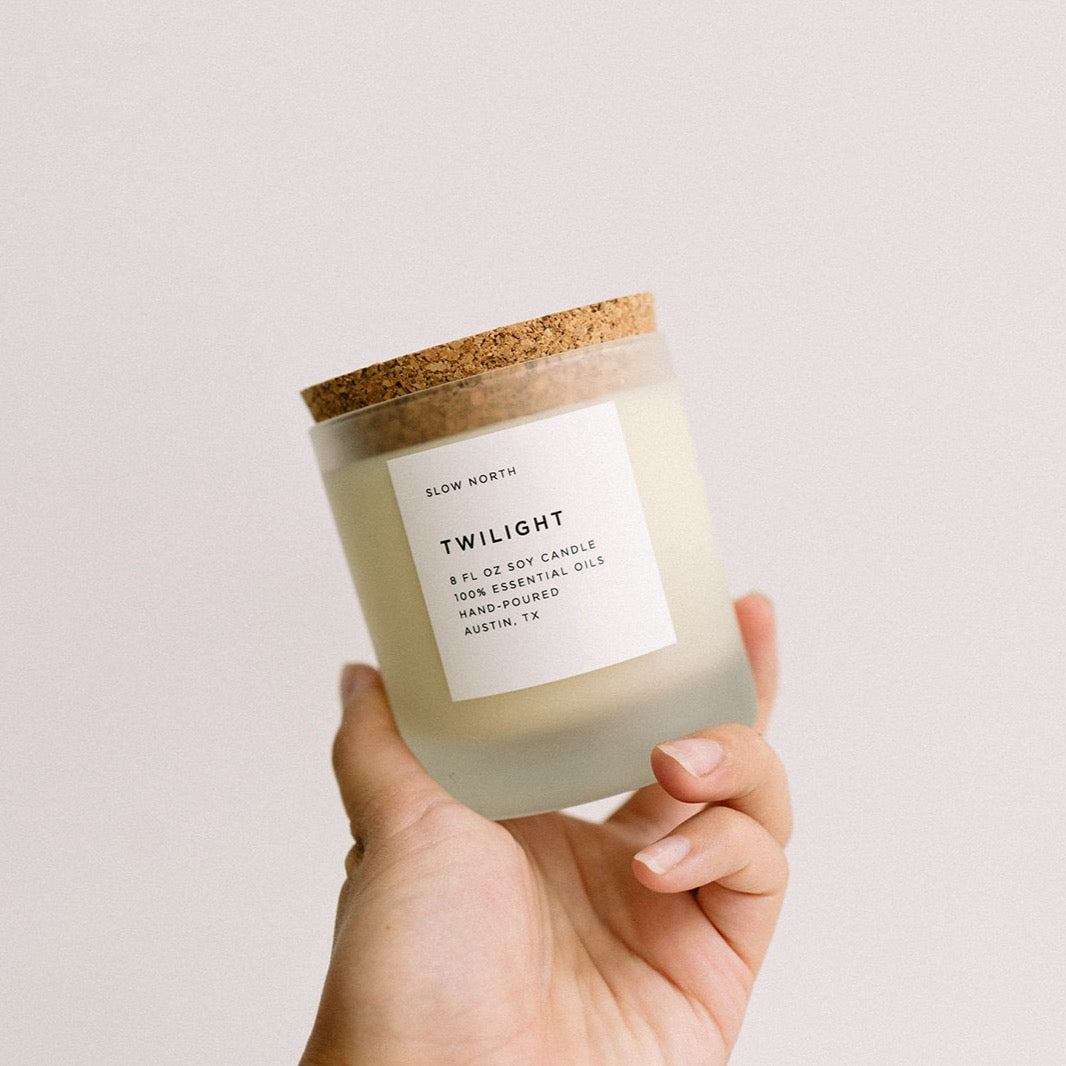 hand holding frosted glass tumblr containing white soy wax candle, twilight by slow north