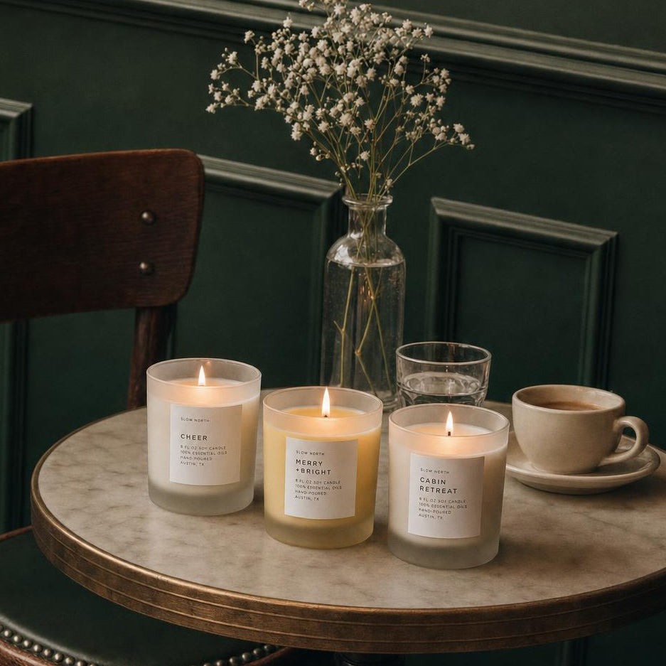 set of 3 winter candles on marble table