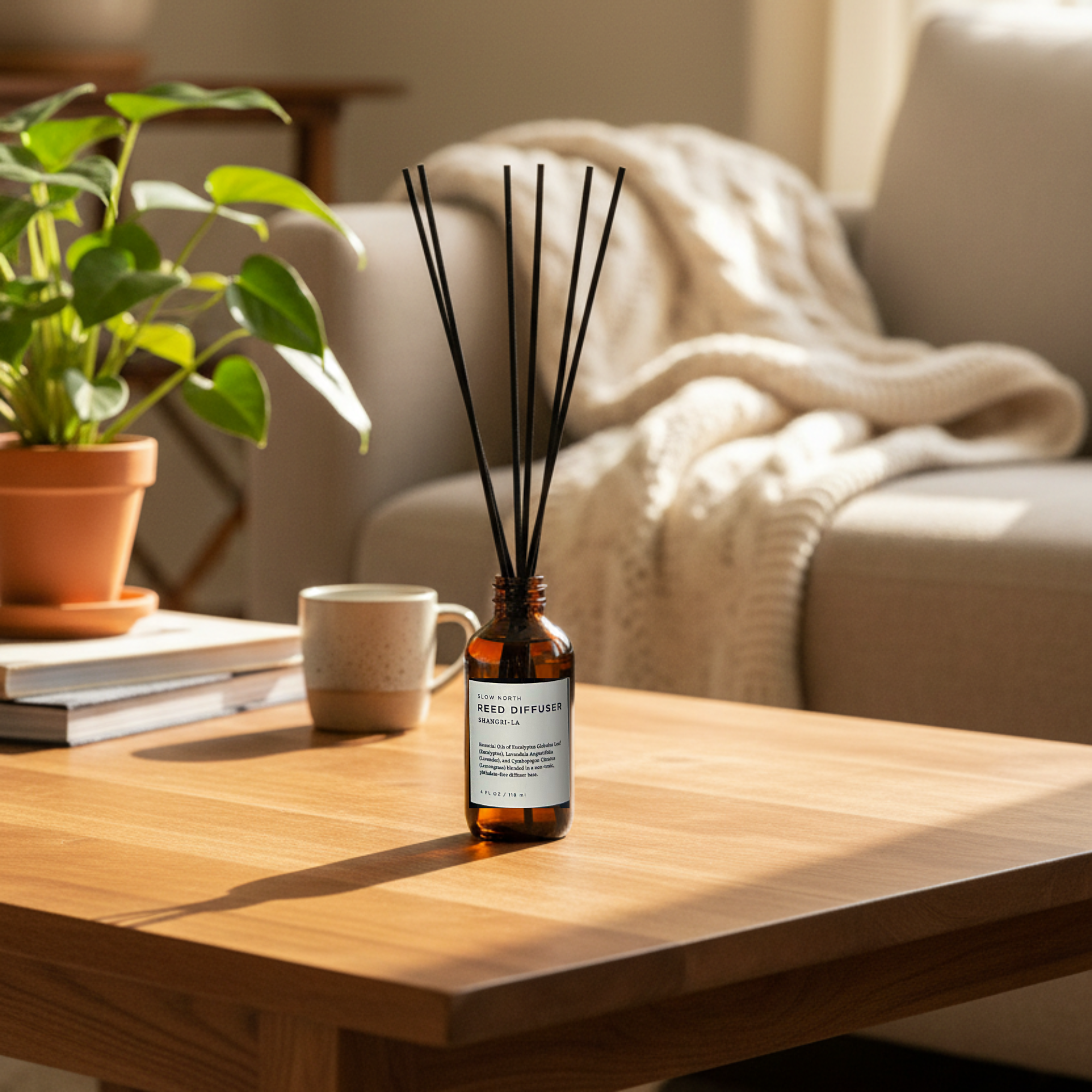 Diffuser bottle on a wooden table with a cozy living room background
