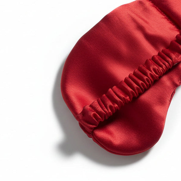 Close-up of a red fabric product with textured edge on a white background