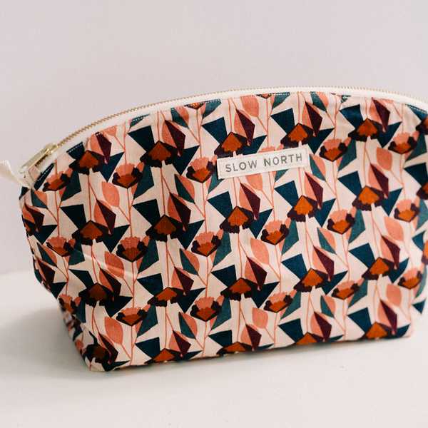 pink and red handcrafted gold zipper cosmetic bag made by slow north