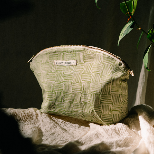 green handcrafted gold zipper cosmetic bag made by slow north