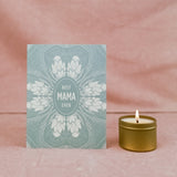 Sea-foam green with floral design Hand drawn 4.25" x 5.5" print greeting card.  Next to lit 2 ounce candle. Best Mama Ever Card by Slow North