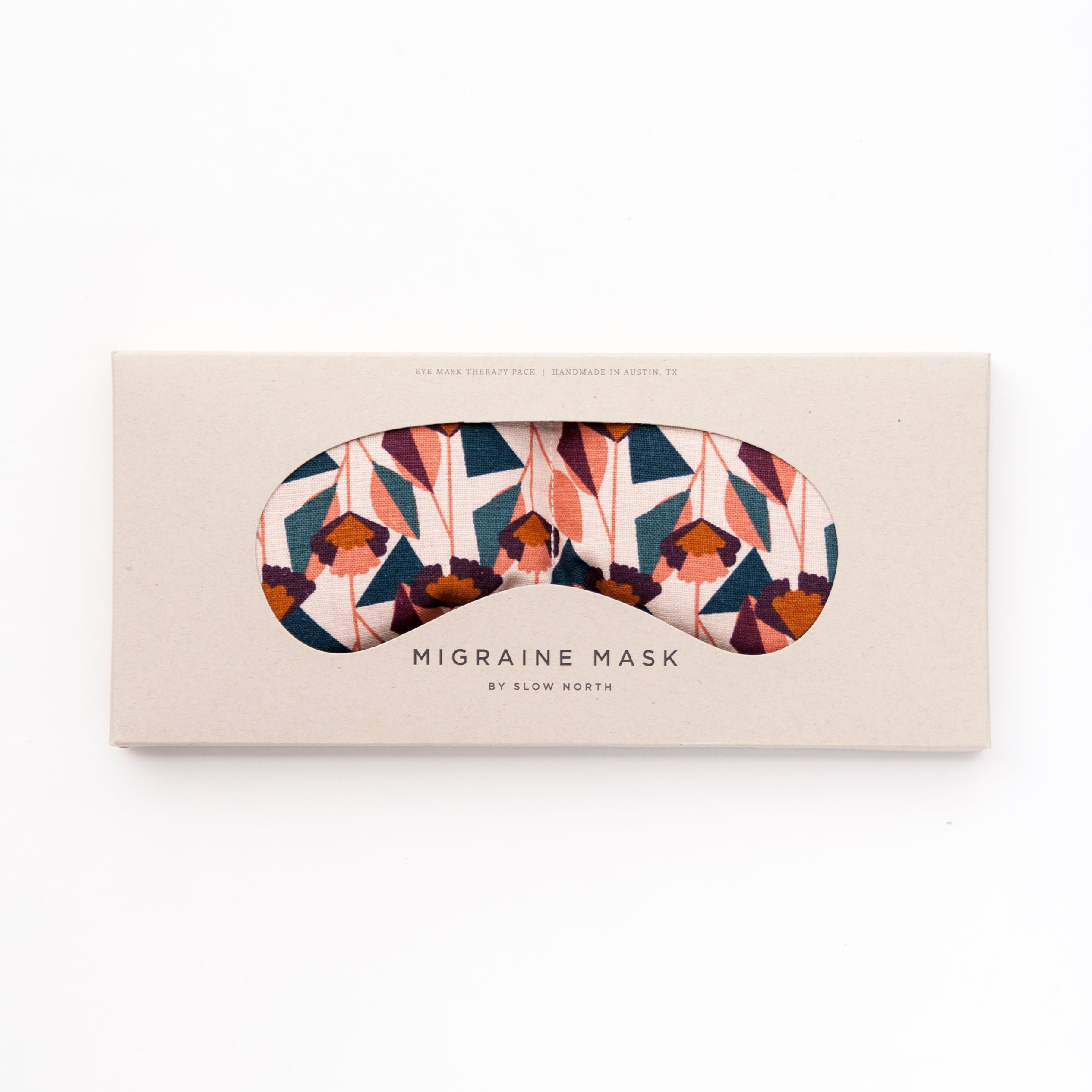 Colorful geometric fabric pattern of various pinks, cream, dark blue, dark orange.