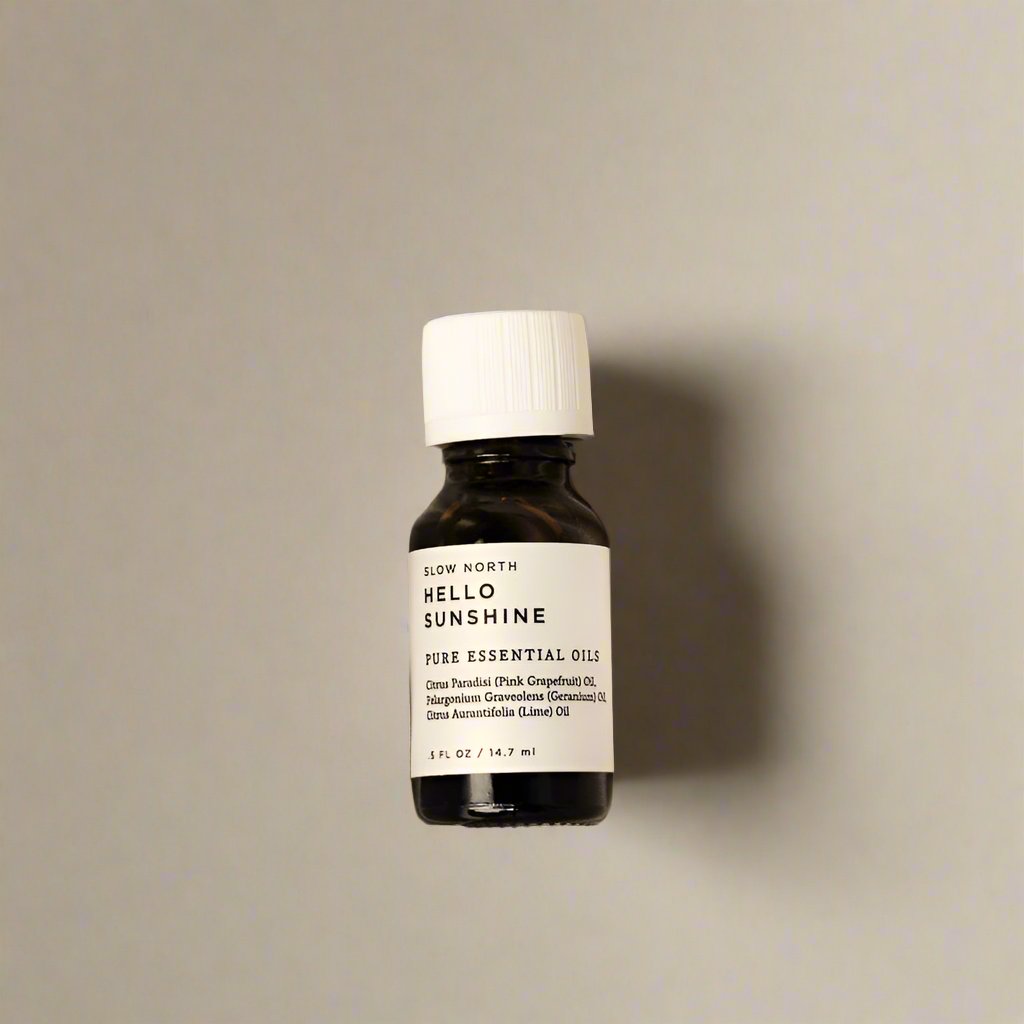 Hello Sunshine 100% pure essential oil blend from Slow North in an amber bottle.