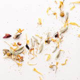 Herbal bath tea ingredients against a white background. By Slow North