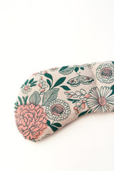 Pink and green floral pattern on cream fabric.