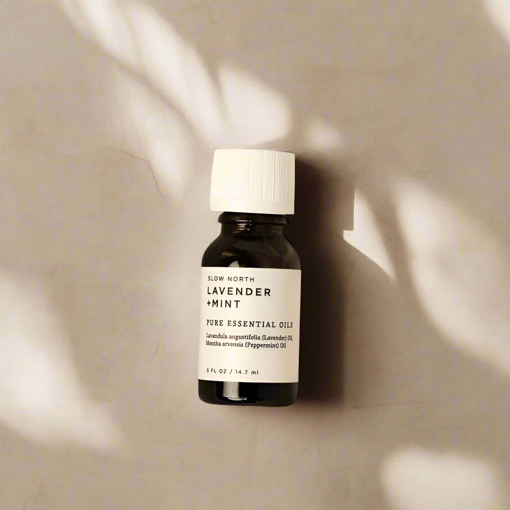Lavender and mint 100% pure essential oil blend from Slow North in an amber bottle.