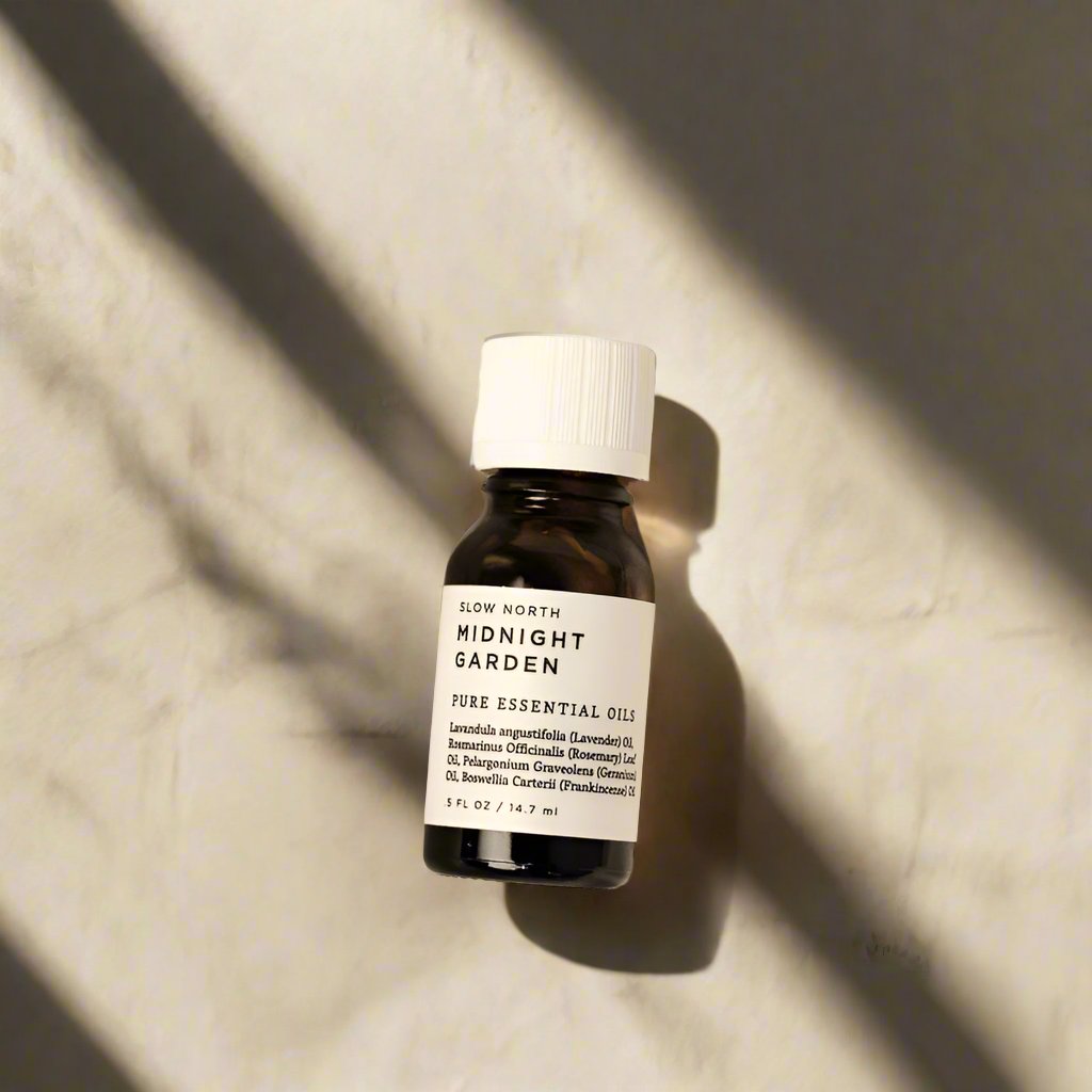 Midnight Garden 100% pure essential oil blend from Slow North in an amber bottle.