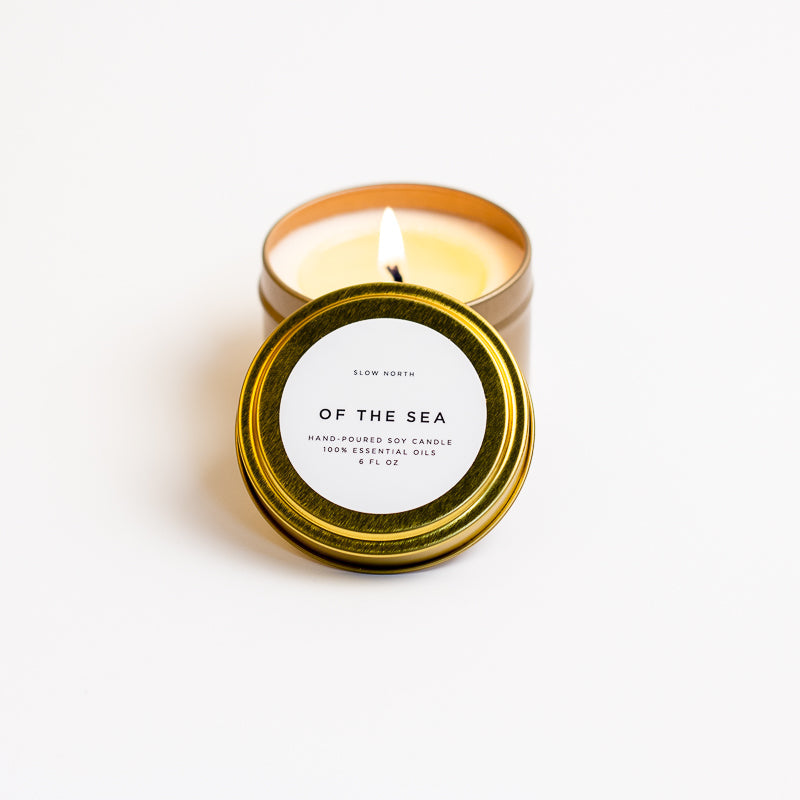 Of The Sea soy wax candle in 6 ounce gold travel tin by Slow North