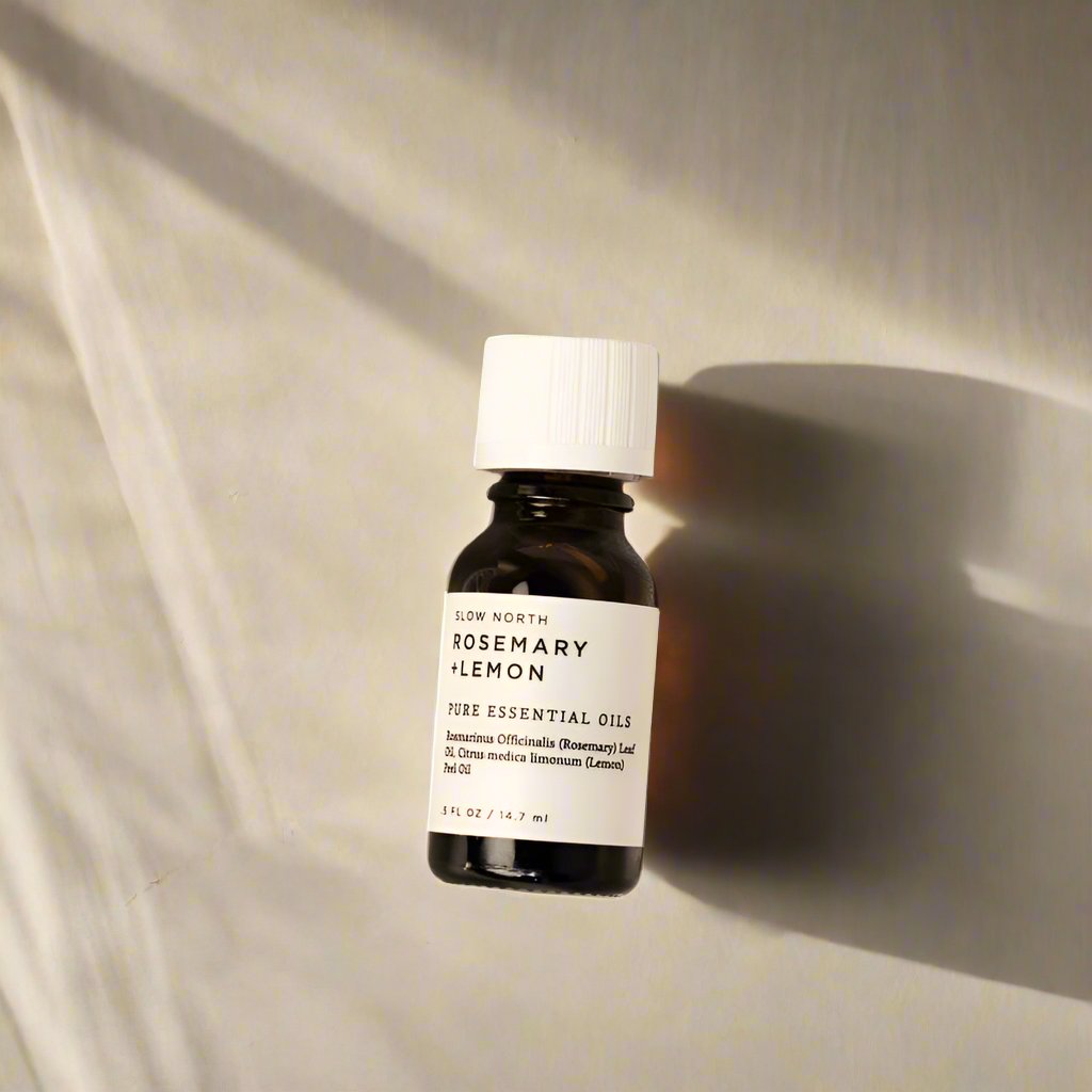 Rosemary and Lemon 100% pure essential oil blend from Slow North in an amber bottle